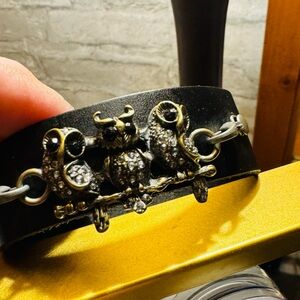 Black leather bracelet with owls of gold and silver hardware